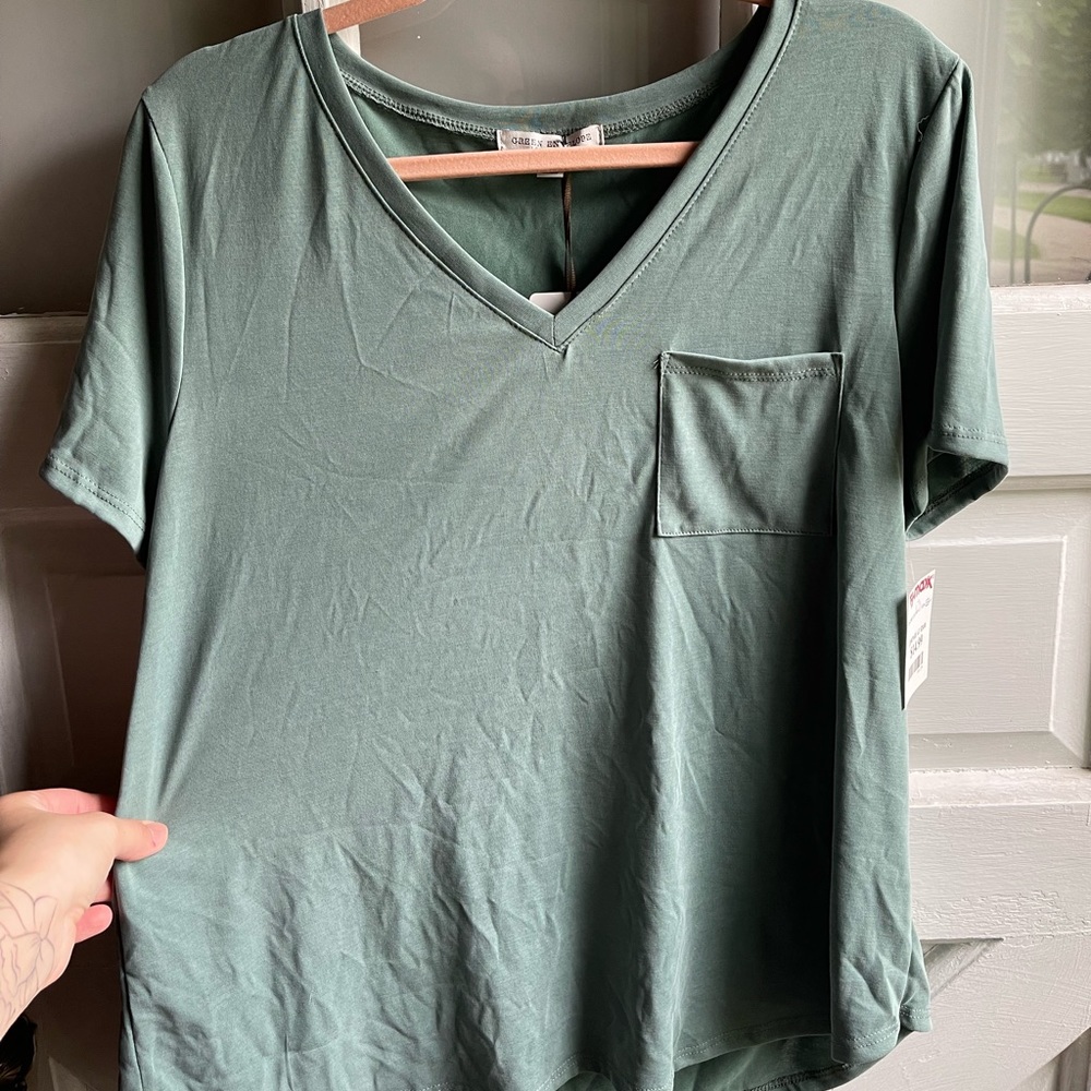 Woman’s green T-shirt with pocket Size Large